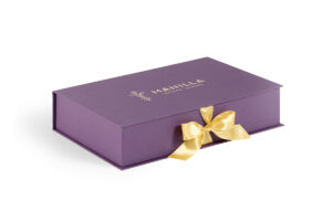 a purple box with a gold bow