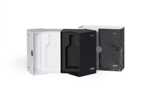 a black and white box with a bottle inside