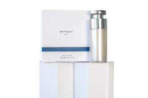 White shoulder box for perfume showcasing a perfume bottle with secure fitment.